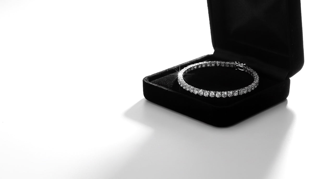Lab-grown moissanite tennis bracelet in an open black velvet gift box